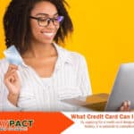 girl holding a laptop and credit card