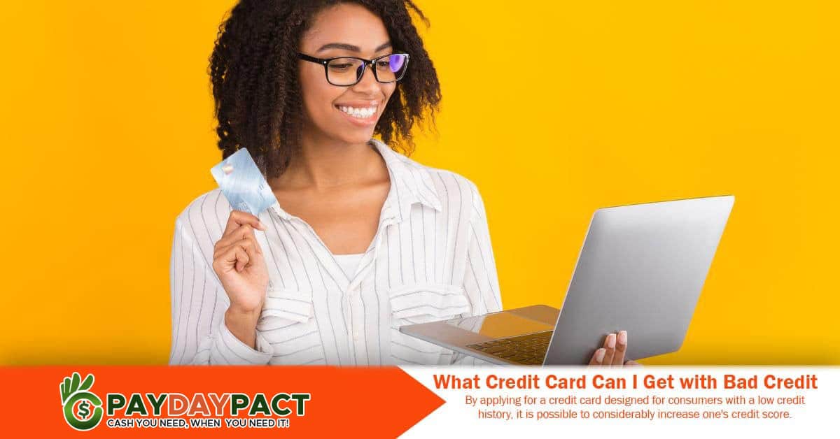 girl holding a laptop and credit card